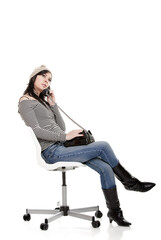 Fototapeta premium Young woman talking at telephone - Isolated on white