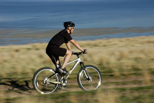 Blur of man on mountain bike, Antelope Island, Utah