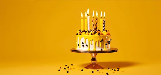 Foto op Plexiglas Birthday blueberry cake with candles and drip yellow frosting on a stand on a yellow background. Banner for Birthday party. Generative AI © Galina_R