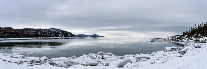 Fototapeta na wymiar Beautiful winter panorama along the shores of the St. Lawrence River during winter