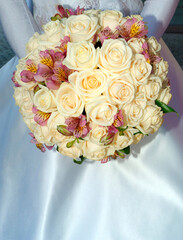 A shot of wedding sweet bouquet in brides hands