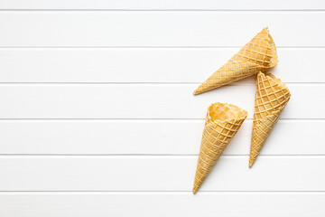 Empty wafer cone. Sweet ice cream cornet on kitchen table. Top view.
