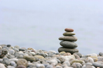 Fototapeta na wymiar round stones for meditation on blurred background