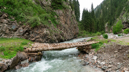 Jeti-Oguz Canyon in Kyrgyzstan is a breathtaking natural wonder, with its flowing river that carves through the rugged landscape, creating a stunning contrast of colors for outdoor enthusiasts.