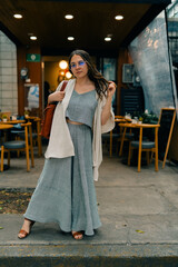 Portrait of beautiful young hippie woman in boho style