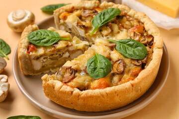 Mushroom pie with spinach leaves and champignons on beige background