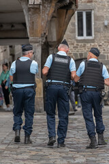 Policemen in the od town of Dinan, France - obrazy, fototapety, plakaty