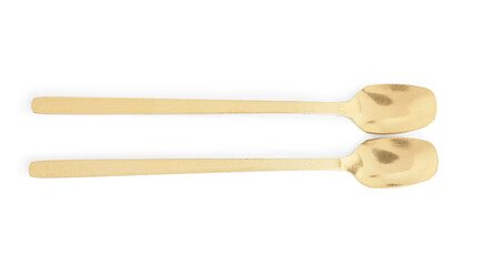 Golden spoons on white background