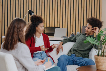 couple of man and woman at psychologist, taking care of mental health in relationship. joint therapy for solving communication problems in family. moral support for young African Americans married