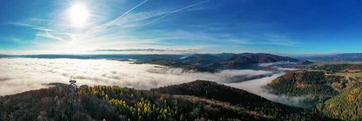 Aerial Drone Shot: Sightseeing Tower in Brezno, Autumn Scenery with Misty Morning and Cloud...