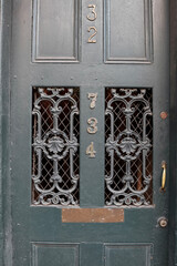old wooden door with wrought iron
