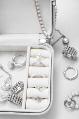 Organizer with stylish jewelry on white background
