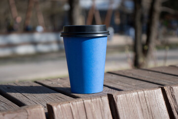 Paper cups of coffee on the street. Mockup of a cardboard cup of coffee. A mockup for a Takeaway...