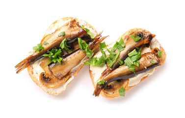 Tasty sandwiches with canned smoked sprats on white background