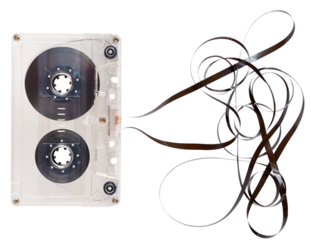 Cassette tape with unrolled tape for recording sounds and music. Isolated background.