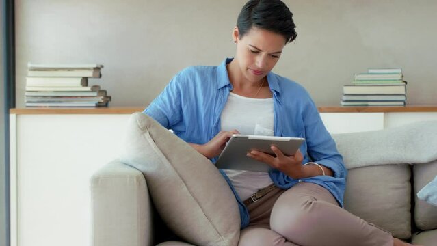 Relax, ebook or woman with tablet on sofa for social media, networking or blog content review in living room. Technology, daydreaming or female for communication, internet or website search at home