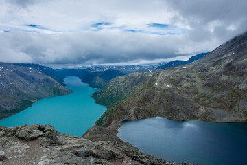Fototapeta premium Amazing view of the Besseggen ridge, famous hiking spot in Jotunheimen National Park, admiring two glacial lakes with different colors