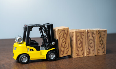 Forklift stacks wooden crates. Transportation industry. Transport department. Warehousing and logistics concept.