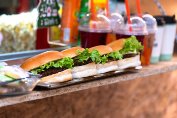 Counter with burgers and drinks