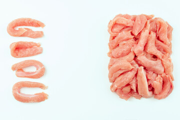 Fresh frozen pieces of turkey meat on a white background.Raw chicken.Frozen chicken fillet..Ogranic food and healthy eating.frozen turkey or poultry meat.