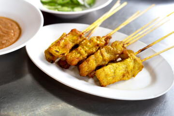 Grilled pork satay with peanut sauce