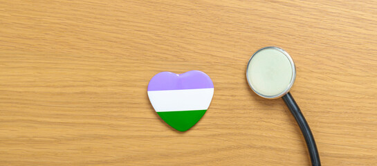 Queer Pride Day and LGBT pride month concept. purple, white and green heart shape with Stethoscope for Lesbian, Gay, Bisexual, Transgender, genderqueer and Pansexual community
