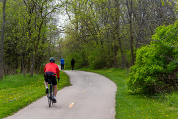 Obraz premium Bicycle And People Walking On The Trail In Spring