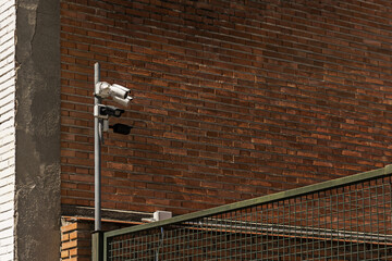 A post with surveillance cameras next