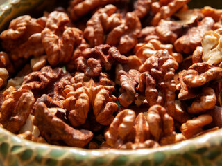 Peeled walnut lies in a bowl