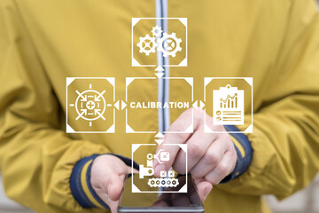 Engineer using smartphone and virtual touch screen sees text: CALIBRATION. Concept of activate calibration, intermediate check or calibration measurement. Mobile calibration operations.