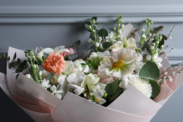Bouquet of beautiful flowers on grey background, closeup