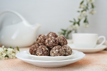 Delicious sweet chocolate candies on beige table