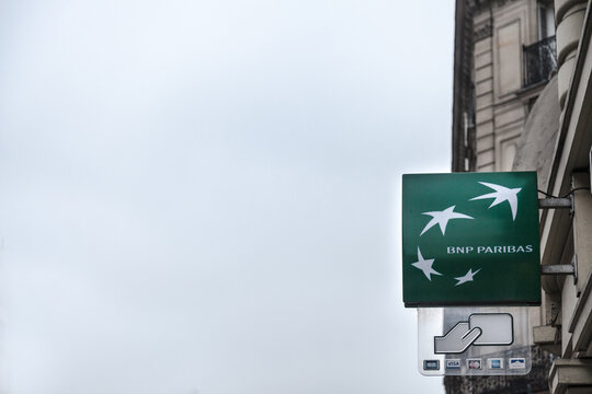 PARIS, FRANCE - DECEMBER 20, 2017: BNP Paribas logo on their bnk branch on Rue de Rivoli avenue. BNP Paribas is a French bank, one of the biggest in France and in EuropeLogo of BNP Paribas on their 
