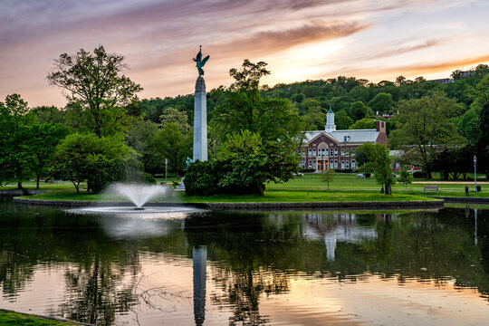 Montclair, NJ - USA - May 13, 2023  Sunset view of Soldiers and Sailors Memorial in Edgemont Park featuring the tall granite obelisk Winged Victory. Designed by sculptor Charles Keck in 1925.