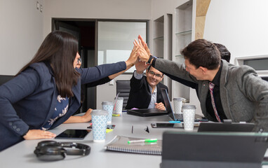 business hispanic milti ethnic group people making hi five to cheer teamwork for success at the...