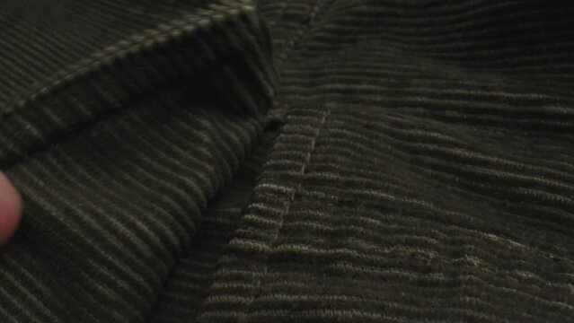 Fingers Touching Velvety Texture Of Corduroy Textile. macro