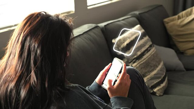 Motion graphics of battery cell overlay, visual effect or VFX, Hispanic woman on phone sitting on couch