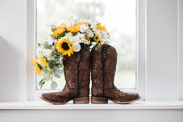 flowers and boots in the window