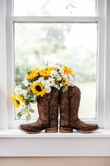 flowers and boots in the window