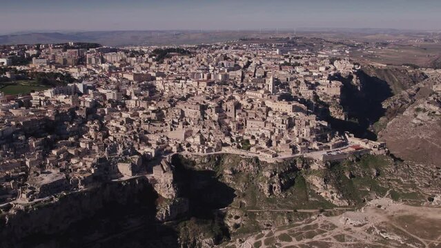 Day aerial over the Ancient Jerusalem looking city of Matera in Basilicata, Italy and its ravine
