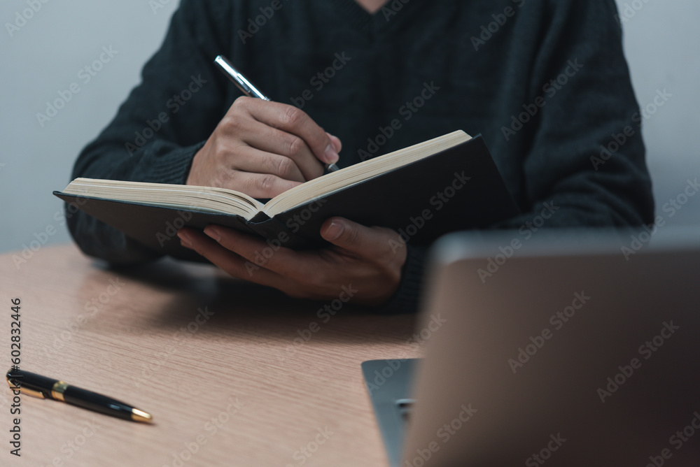Aufkleber learning online class by using laptop computer and writing notebook at workplace, education developm
