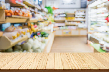 Empty wood table top with supermarket blurred background for product display