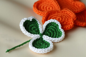 hand-knitted three-leaf clover. The clover is a symbol of good luck and is often associated with St. Patrick's Day and Irish heritage. Generative AI Technology.