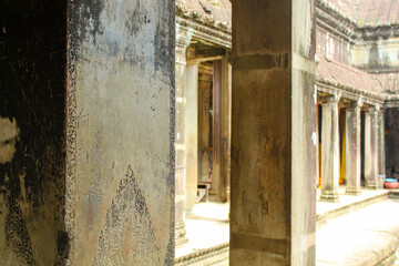 SIEM REAP, CAMBODIA. August 7th, 2019: Ancient walls with decorations At Angkor Wat Temple Complex. Angkor Wat Is A Temple Complex In Cambodia And Is The Largest Religious monument