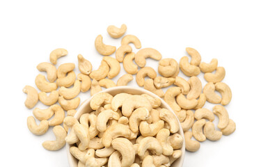 Bowl with tasty cashew nuts isolated on white background, closeup