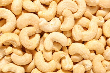 Tasty cashew nuts as background, closeup