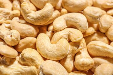 Tasty cashew nuts as background, closeup