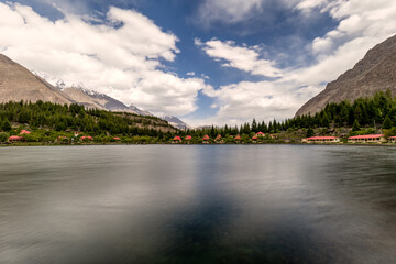 Fototapeta premium Long exposure of Lower Kachura or Shangrila Lake: Immerse in the Pristine Serenity of Turquoise Waters and Majestic Mountains, an Enchanting Gem of Skardu, Gilgit-Baltistan.
