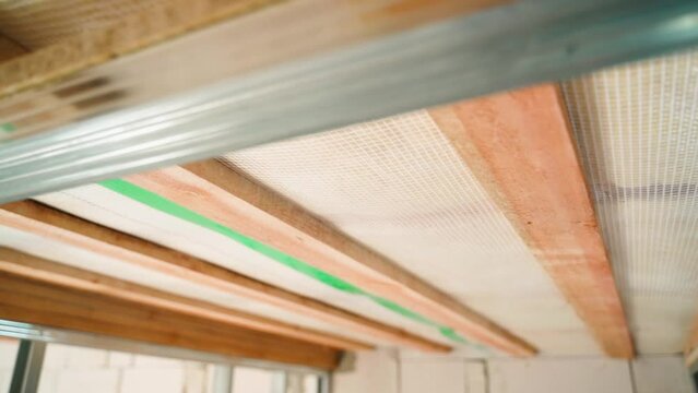 The ceiling of a private house under a roof without repair, close-up