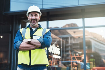 Engineer, portrait of man architect standing in front of construction site and arms crossed. Industrial or architecture, project or management and happy mature male worker with safety helmet - obrazy, fototapety, plakaty
